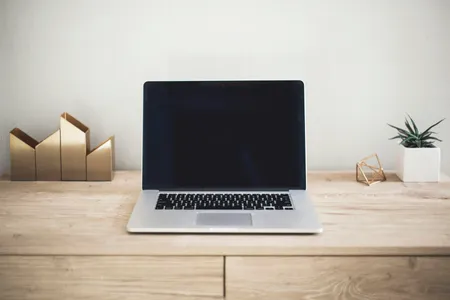 A laptop and notebook set up for studying